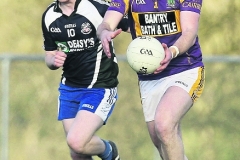 We meet again: Bandon's James O'Donovan cn action against Cill na Martra's Damien Harrington during the Cork IFC round one game at Kilmurrry in April.